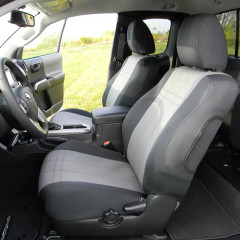 Front cabin of a truck with grey and black neoprene seat covers, providing a durable, snug fit that protects the original upholstery from daily wear and tear.