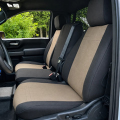 Ford Waterproof CORDURA seat covers on truck 40/20/40 bench, black bolsters with tan ribbed center panels and vertical stitching.
