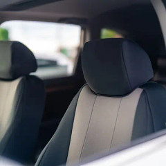 Toyota NeoSupreme Seat Covers close-up showing headrest and two-tone panel detail.