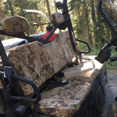 UTV Seat Covers in a rugged camo pattern installed on a side-by-side bench seat for durable off-road protection.