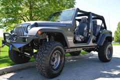 Luxury Line Kryptek Camo Seat Covers installed in a Jeep, Kryptek Typhon camo with black center panels.