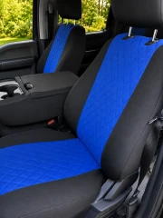 Custom-fit neoprene seat covers in blue and black, featuring a premium diamond-quilted center pattern and a matching center console cover for a modern, sporty look.