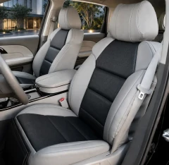 Sof-Touch Leatherette seat covers on front buckets, light gray with perforated black stitched panels and matching console.