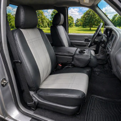 Imitation leather seat covers shown on front bucket seats with armrest, black sides and light gray stitched panel inserts.
