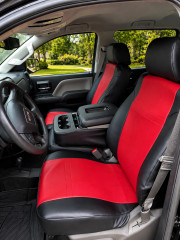 Imitation Leather seat covers on GMC truck front buckets, red stitched centers with black bolsters and headrests.
