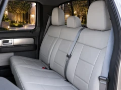 Infographic showing Sof-Touch Leatherette Seat Covers features: side airbag/heated seat compatible, headrest covers, pockets, and access to controls.