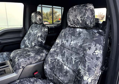 Front bucket seats and center console with Luxury Line Viper Camo Seat Covers for a rugged, tactical interior.
