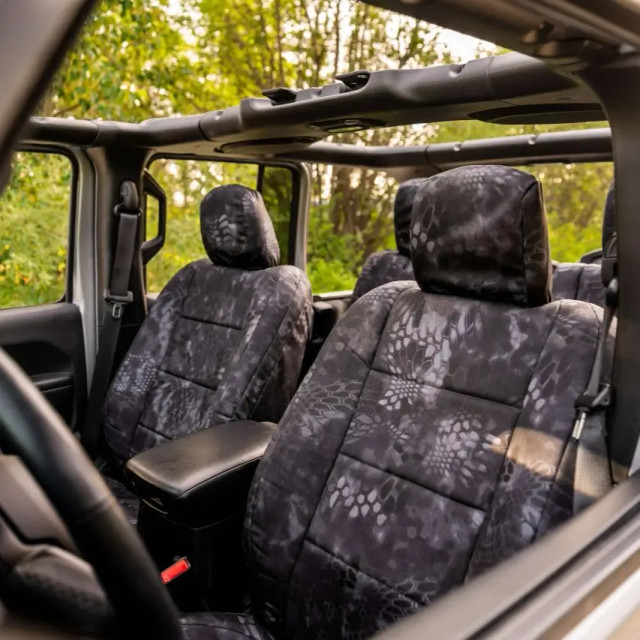 Front bucket seats featuring Kryptek Waterproof Camo Seat Covers in tactical Typhon pattern for a custom-fit look.