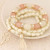 Golden Four-leaf Clover and Tassel Pendants Multi-layer Beads Fashion Bracelet - White A392-fabr1197