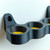 An empty black Quad Rack a tool that has yellow TPU inserts that help protect the bottom of your turning tools