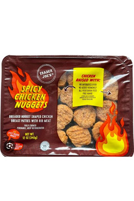 TRADER JOE'S TJ's Spicy Chicken Nuggets, 12oz package of breaded nugget shaped chicken breast patties with rib meat, spicy flavor, featuring flame graphic design on packaging.