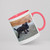 Photo Collage Mug featuring a picture of a cute black puppy standing on a gray carpet with a small plush burger toy in the background.