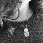 Be a Pineapple Inspirational Necklace on a model in a dark shirt