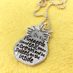 Be a Pineapple Inspirational Necklace on a bright yellow background