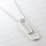Paper Clip Necklace Sterling Silver (Ready to Ship) laying on a piece of binder paper