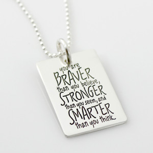 different angle sterling rectangle is hand stamped with 'you are BRAVER than you believe, STRONGER than you seem, and SMARTER than you think' laying on a white background
