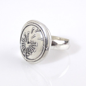 Dandelion Wax Seal Inspired Ring on white background
