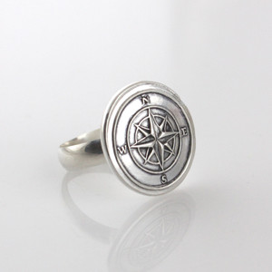 Compass Rose Wax Seal Inspired Ring sitting on a white background