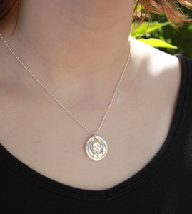 Labrador Retriever Wax Seal Inspired Necklace on a model in a black shirt