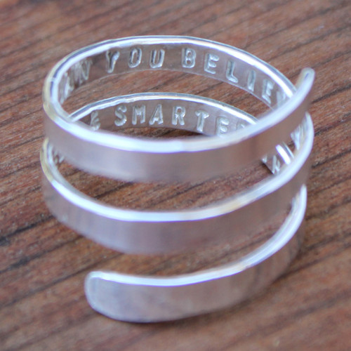 Sterling silver spiral ring with a hand stamped message inside