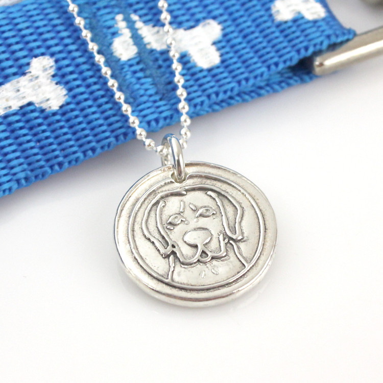 Labrador Retriever Wax Seal Inspired Necklace sitting with a blue leash