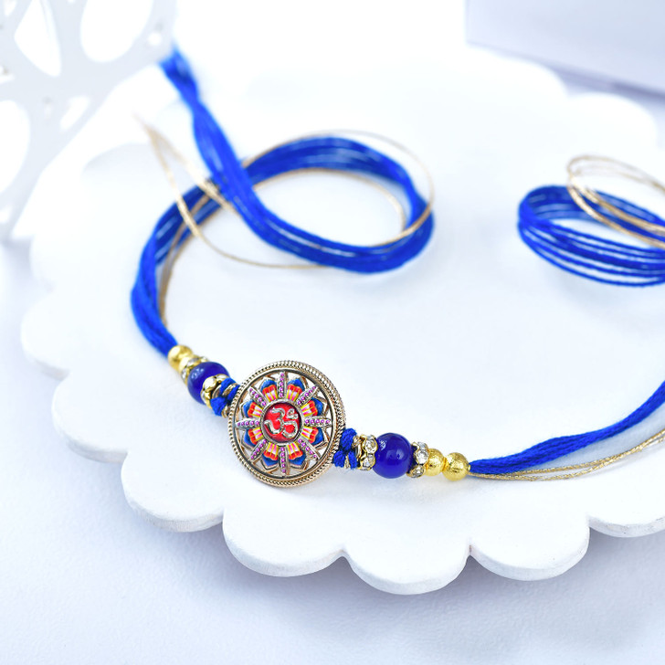 Elegant Meenakari Rakhi with Royal Blue Thread