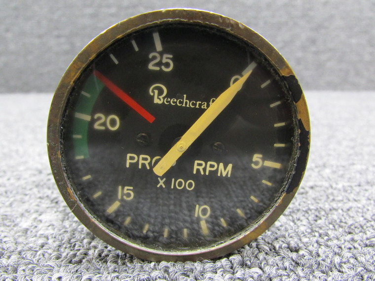 Beechcraft 99 Propeller Tachometer Indicator (Cloudy Face and Worn Paint)