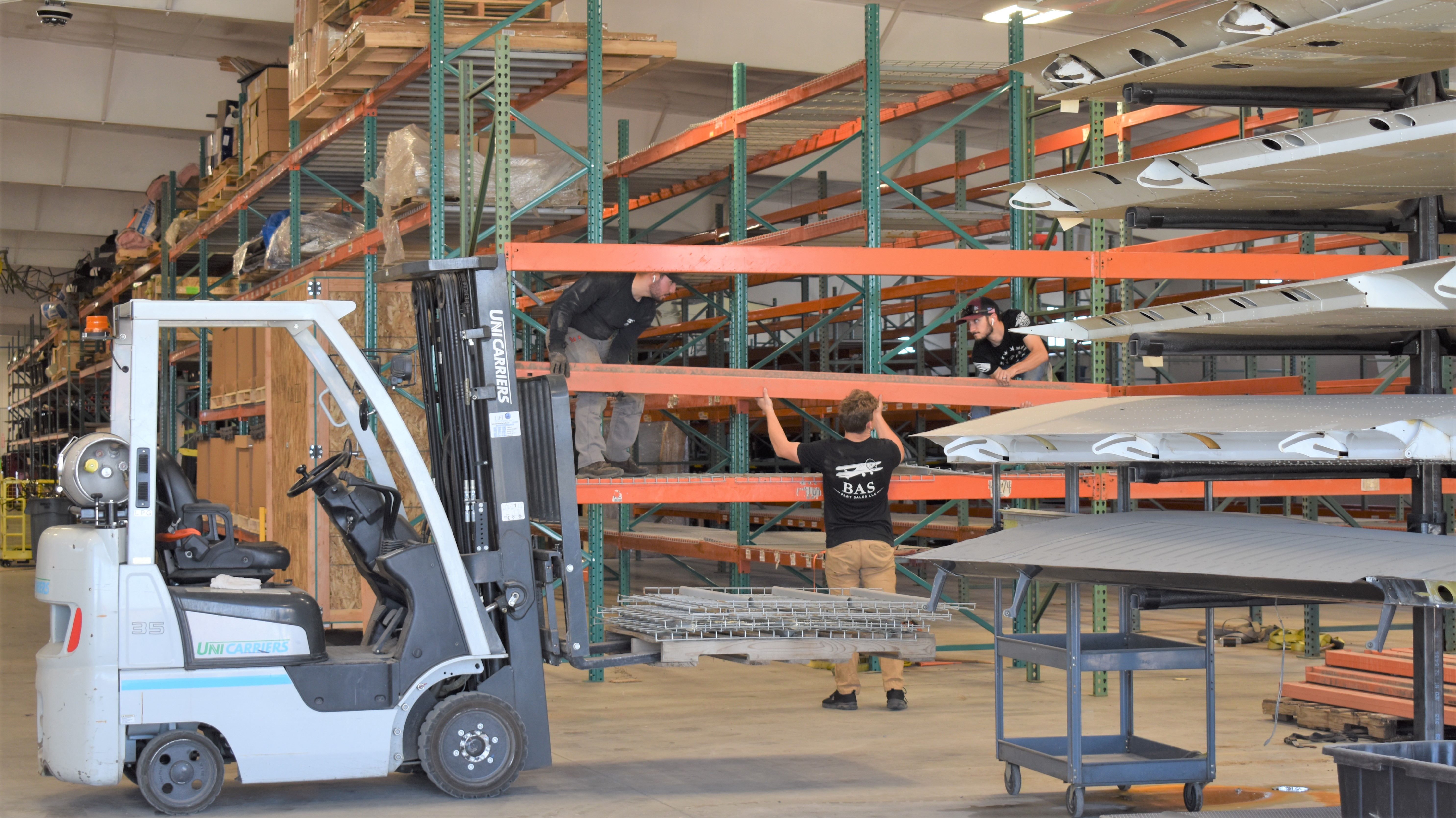 The BAS team building shelving to store more airplane parts in our newly extended airplane parts warehouse in Greeley, CO