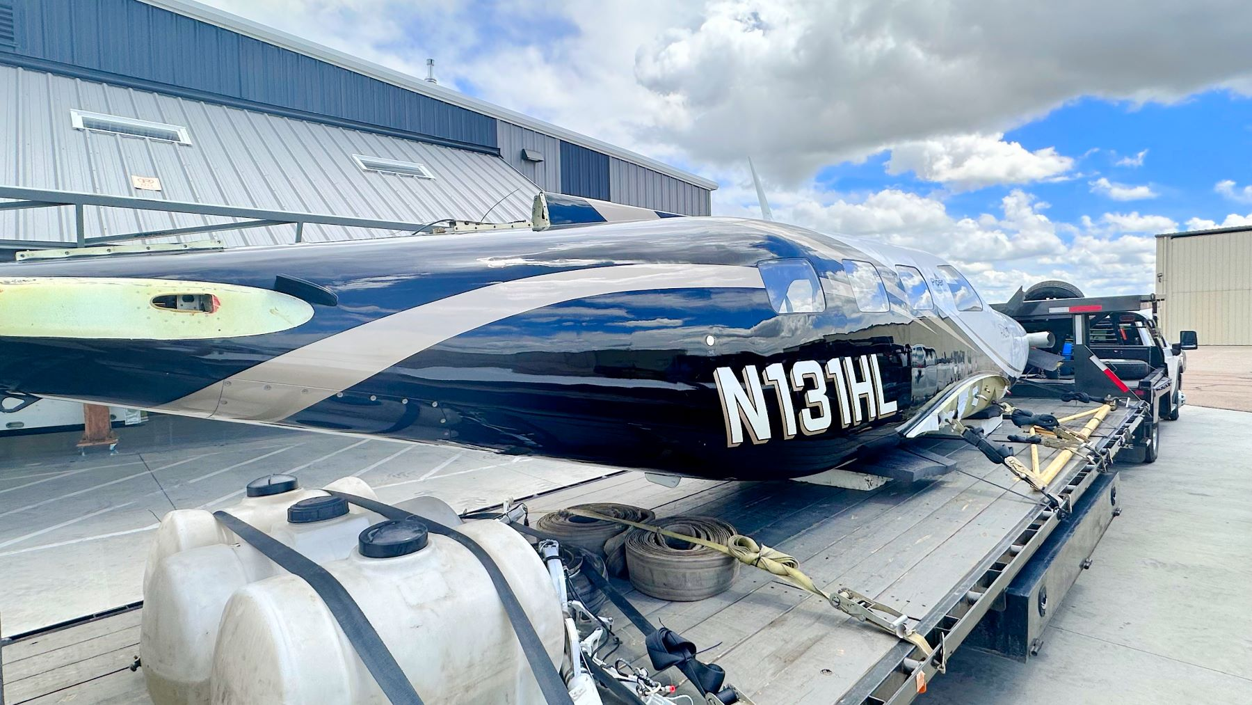 Piper M600 salvaged aircraft on the trailer at BAS Part Sales in Greeley, CO