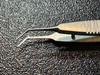 Jaw photo of Storz E1813A McPherson Suturing Corneal Forceps, ANG
