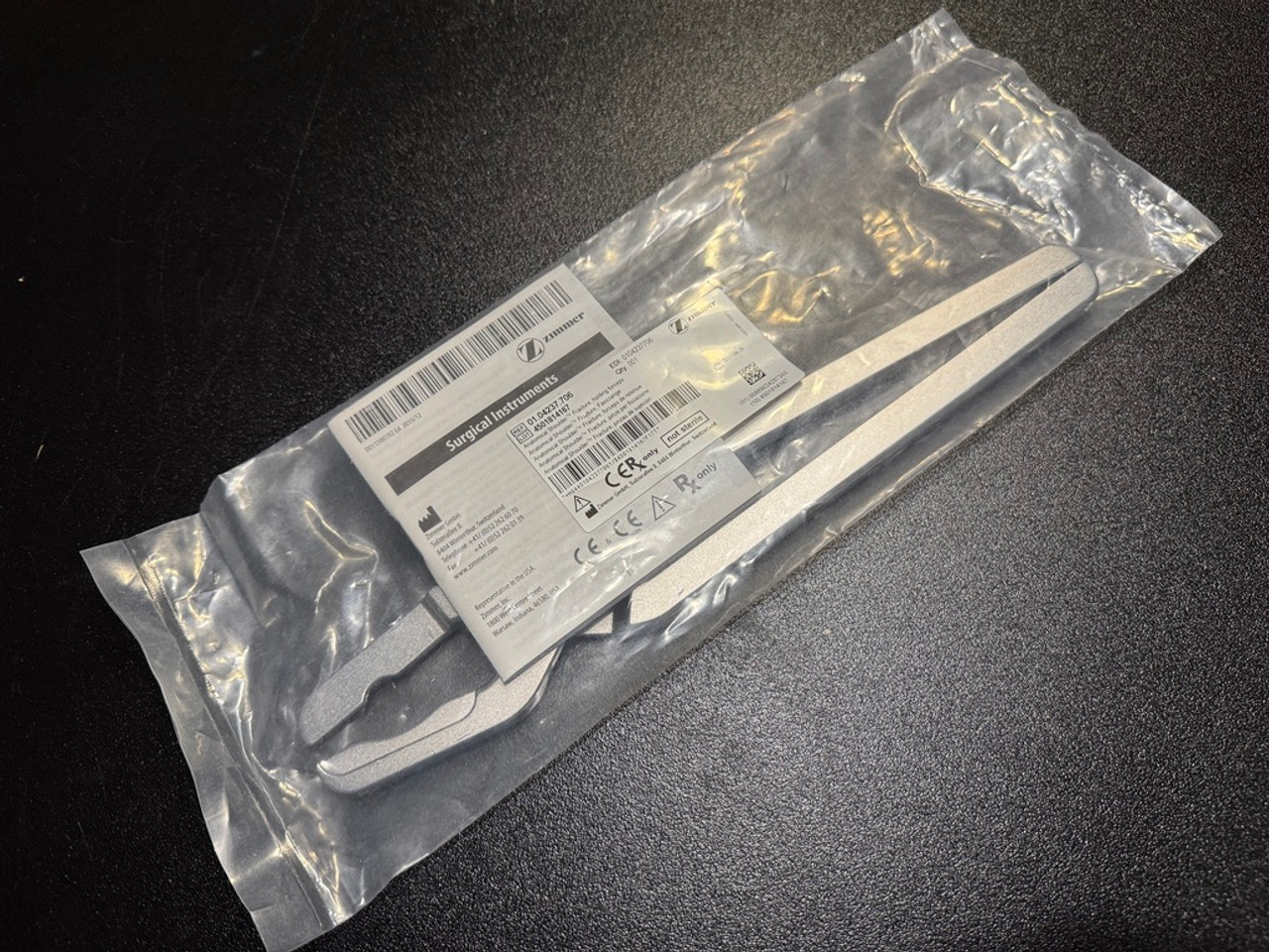 Package photo of Zimmer 01.04237.706 Anatomical Shoulder Fracture Holding Forceps (New)