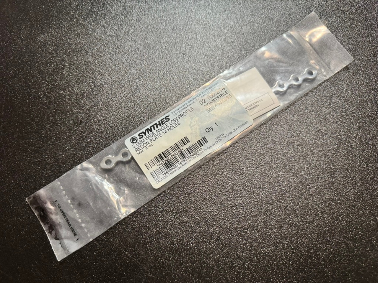 Photo of Synthes 02.100.214 Wide Angle Low Profile Reconstruction Plate, 3.5mm, 14 Holes