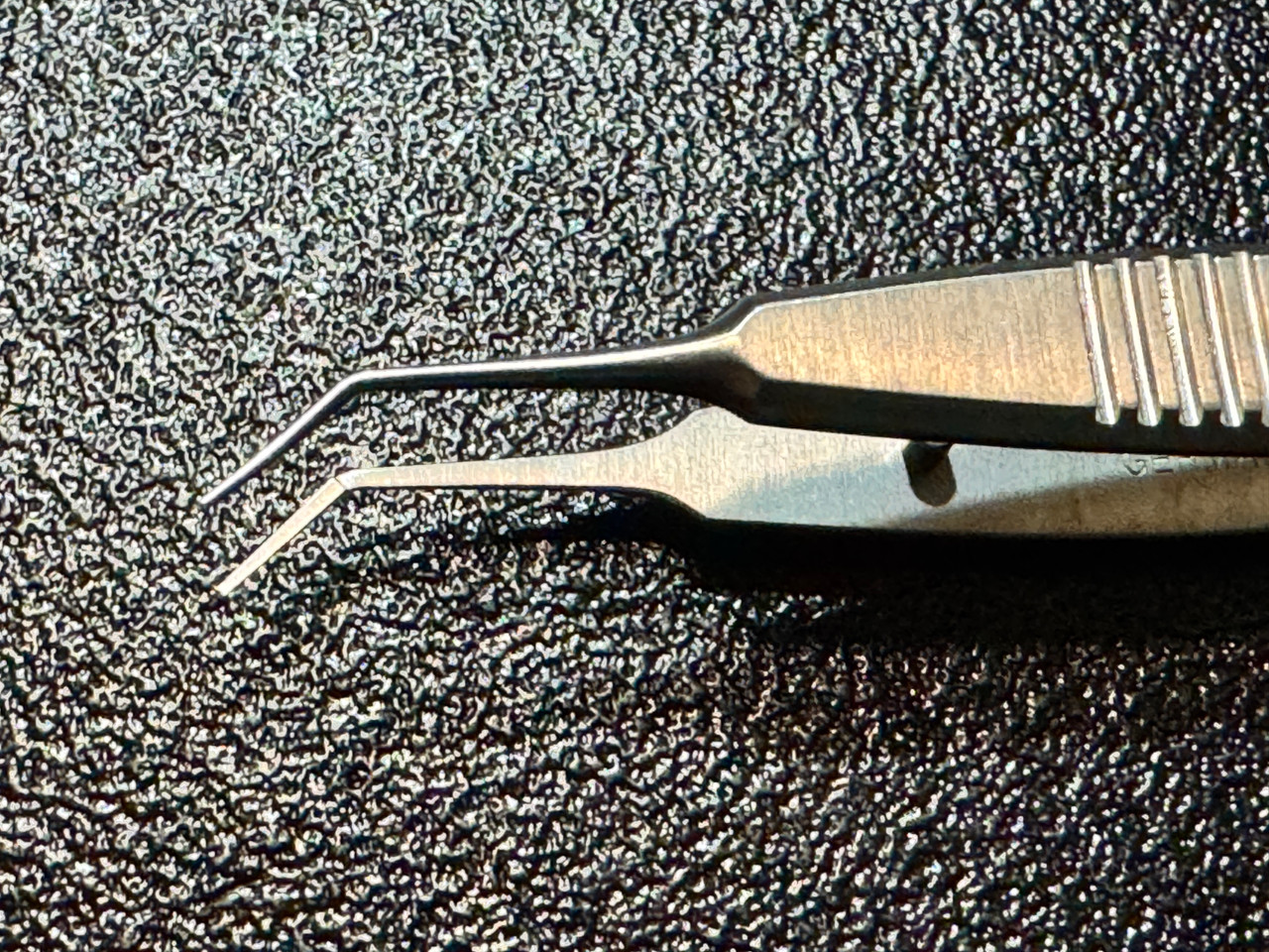 Jaw photo of Storz E1813A McPherson Suturing Corneal Forceps, ANG