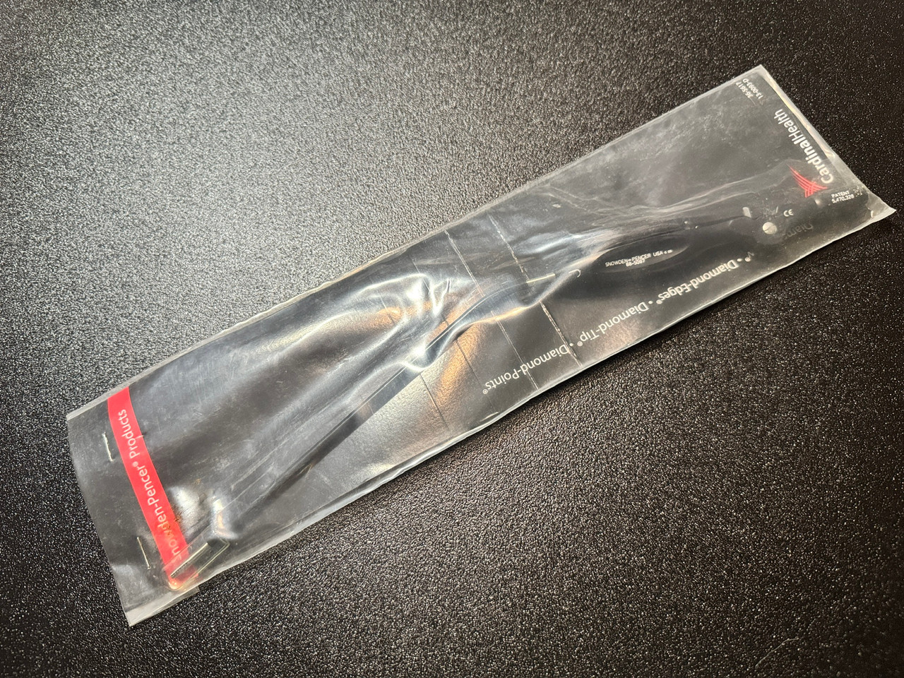 Package photo of Snowden-Pencer 88-5097 Ramirez EndoForehead Grasping Forceps, ANG Down, J (New)