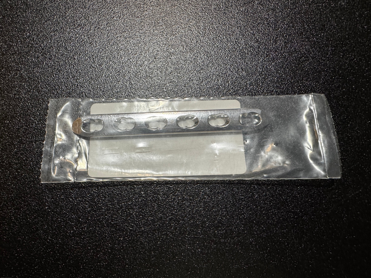 Plate photo of Synthes 224.561 4.5mm Narrow LCP Plate, 6H, 116mm