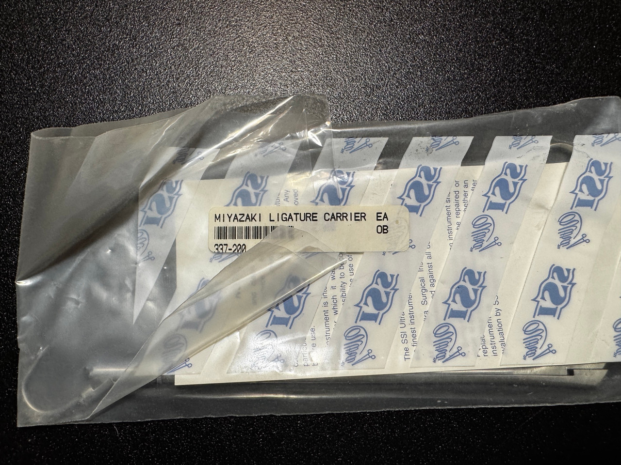 Package photo of Symmetry 337-200 Miya Hook Ligature Carrier (New)