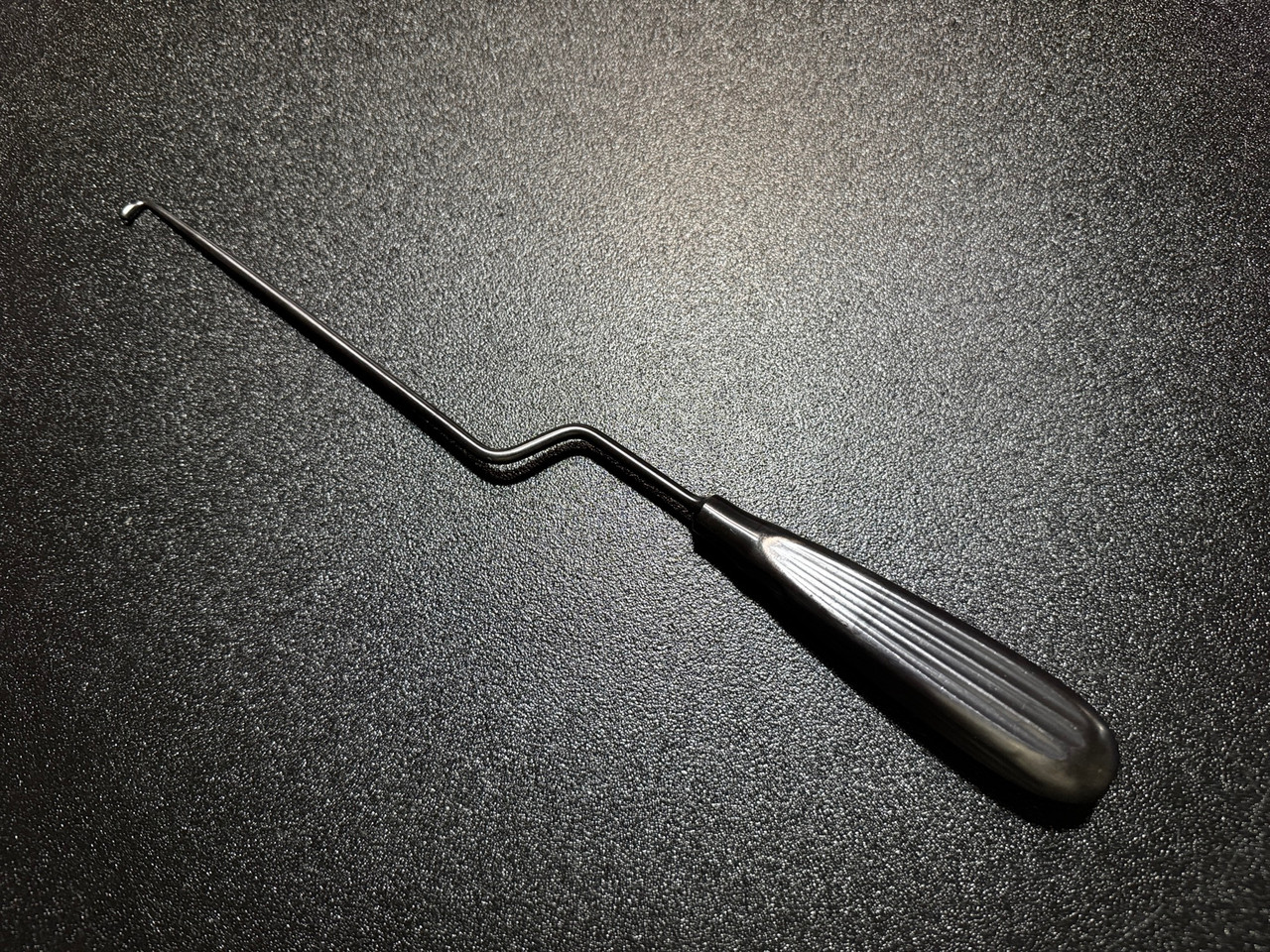 Handle photo of Medtronic 9560629 METRx Bayoneted Reverse ANG Cup Curette, 3.6mm