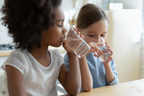 Small children drinking water