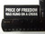 Product photo of Price of Freedom was hung on a Cross available at Forever And Always Online, Farmerville, Louisiana.