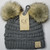 Product photo of the BABY C.C BEANIE POM POM LT GREY baby beanie hat, showing the soft knit fabric, color, and pom pom detail, available at Forever And Always Online.