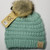Product photo of the BABY C.C BEANIE POM POM MINT baby beanie hat, showing the soft knit fabric, color, and pom pom detail, available at Forever And Always Online.