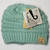 Product photo of the KIDS C.C MESSY BUN BEANIE MINT baby beanie hat, showing the soft knit fabric, color, and pom pom detail, available at Forever And Always Online.