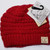 Product photo of the KIDS C.C MESSY BUN BEANIE RED baby beanie hat, showing the soft knit fabric, color, and pom pom detail, available at Forever And Always Online.