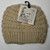 Product photo of the KIDS C.C MESSY BUN BEANIE BEIGE baby beanie hat, showing the soft knit fabric, color, and pom pom detail, available at Forever And Always Online.