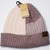 Product photo of the C.C BEANIE ROSE/TAUPE baby beanie hat, showing the soft knit fabric, color, and pom pom detail, available at Forever And Always Online.