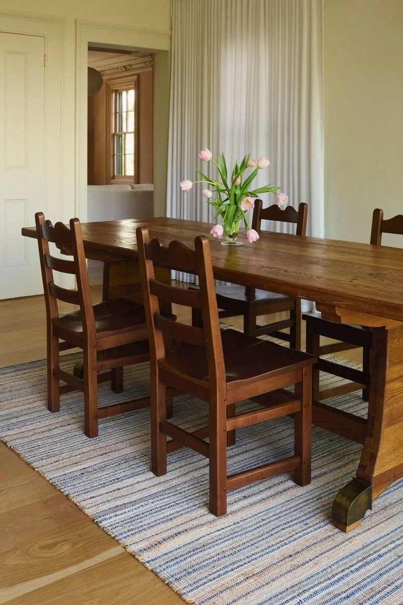 Capri Stripe Blue jute rug under a dining table