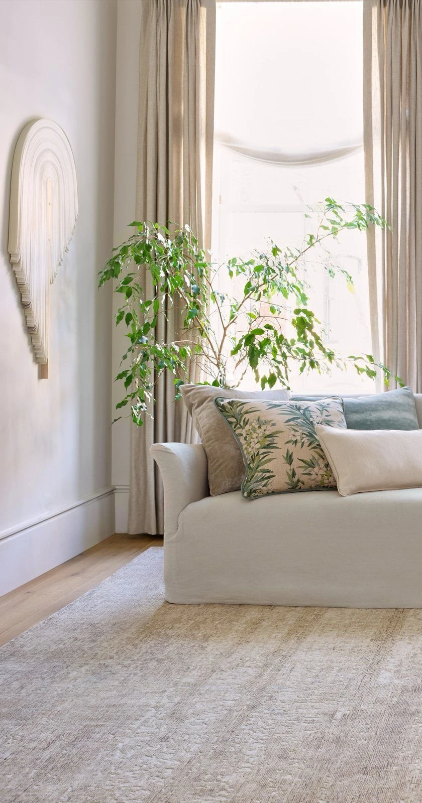 Lined drapery panels at a sunlit window