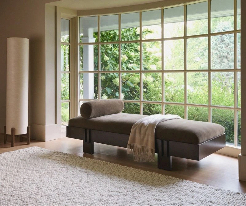 Serenity Ivory wool rug under a chaise