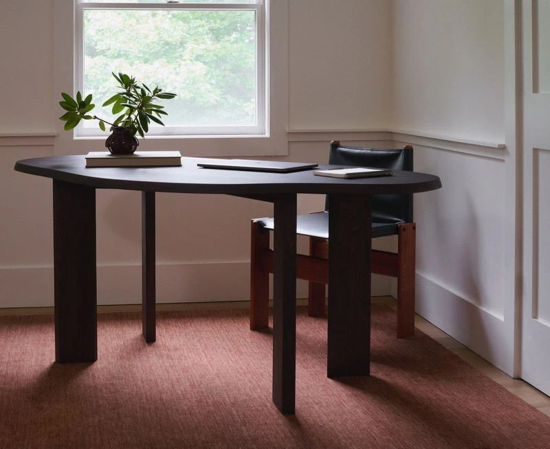 Simon Spice wool rug under a desk