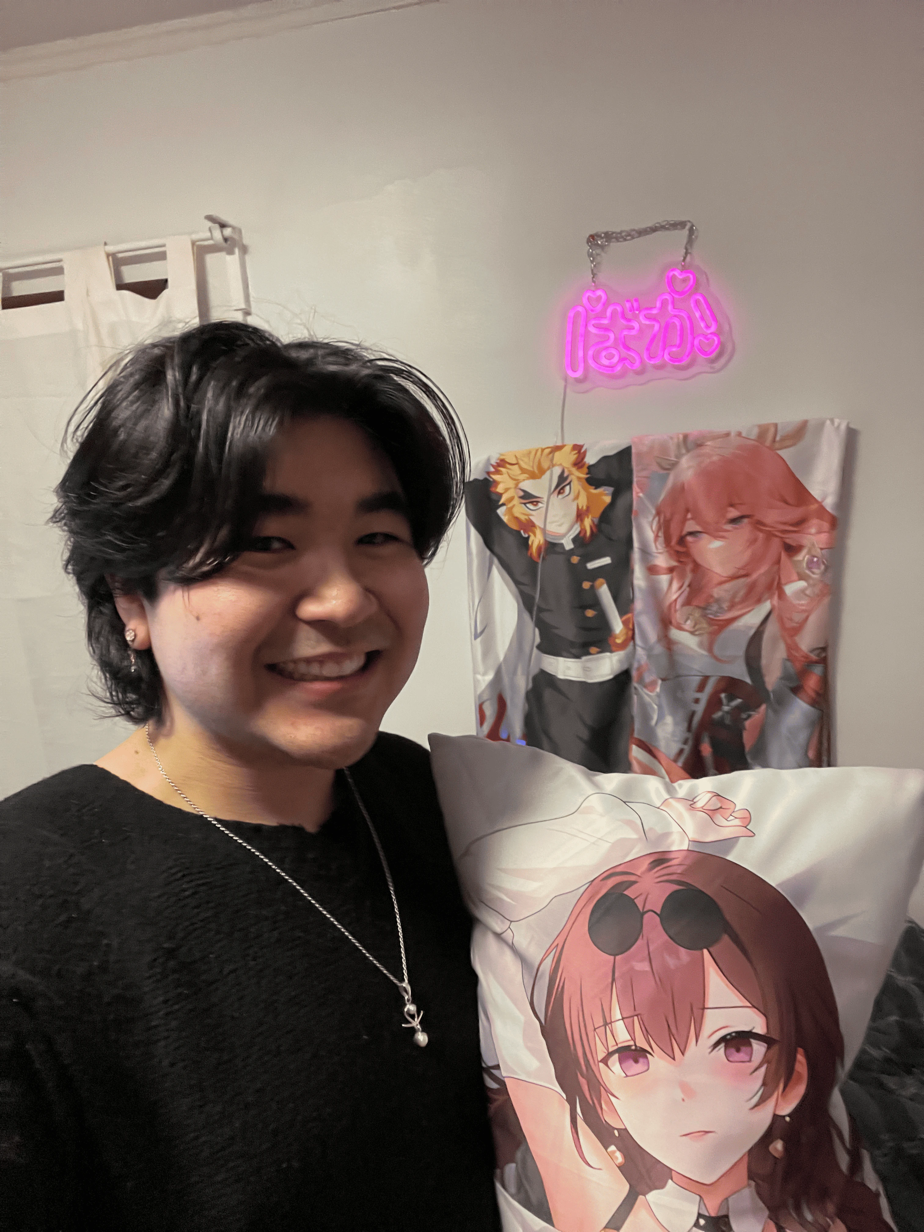 Person hugging an anime body pillow on a couch